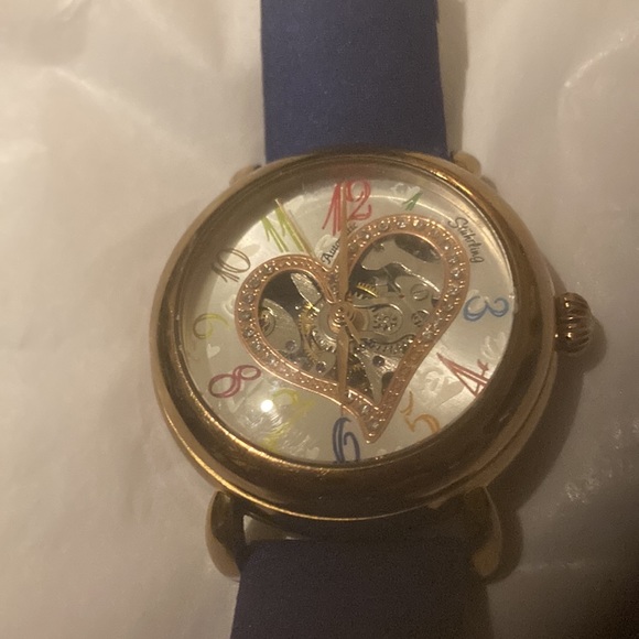Gorgeous Stuhrling woman’s skeleton watch with several colored bands. - Picture 2 of 9